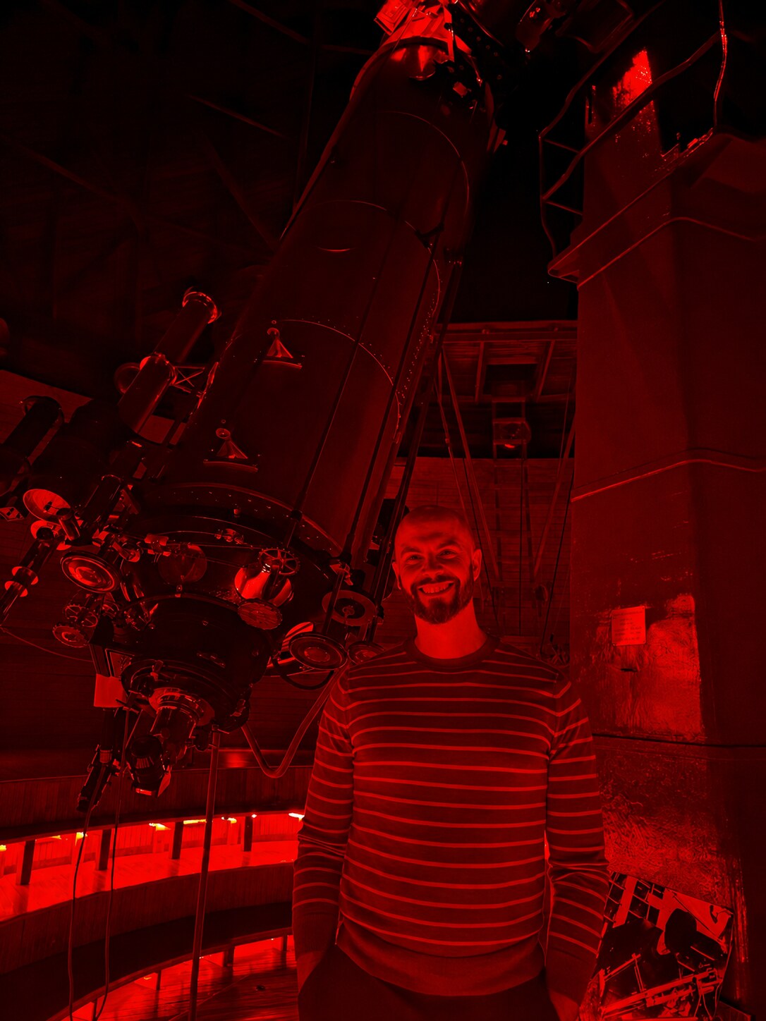 Dagomar Degroot beside a telescope at Lowell Observatory